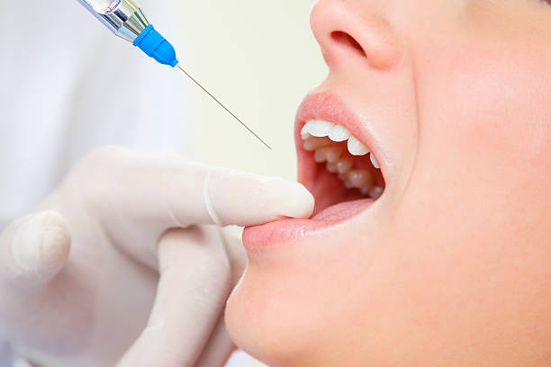 Patient receiving comfortable dental anesthesia before treatment